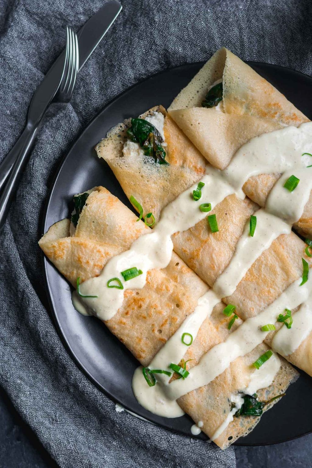 Savory Crepes with Almond Cheese, Sautéed Spinach and Vegan Hollandaise •  The Curious Chickpea